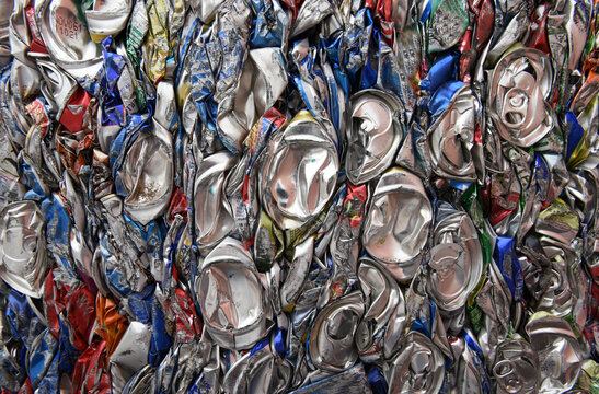 Compressed, crushed, smashed, flattened aluminum soda and beer cans for scrap metal recycling in the USA
