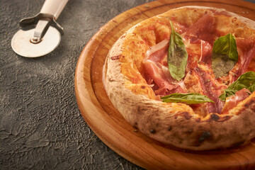 Delicious prosciutto pizza and a pizz