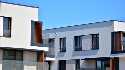 Condominium and apartment building with  symmetrical modern architecture. Detail in modern residential flat apartment building exterior. Fragment of new luxury house and home complex. 