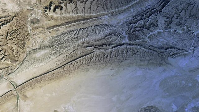 Desert landscape aerial satellite view Hingol national park, sunrise animation. Based on image furnished by Nasa