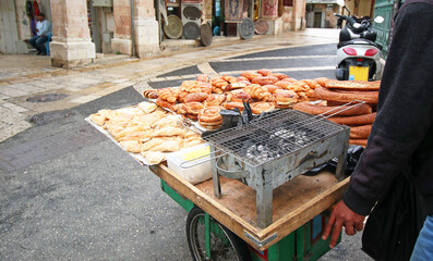 Street Food. Bread Vendor selling traditional middle east, Arab bread. Old city of Jerusalem, Israel.
