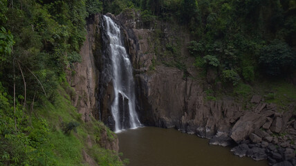 Fototapeta na wymiar Waterfall in the rainforest is very good location for travel in holiday.
