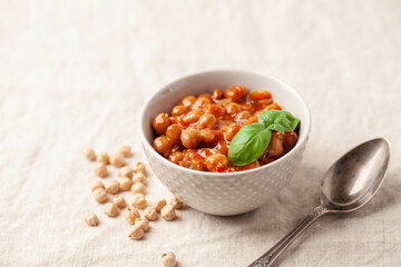 Piquant boiled  chickpeas in a sauce with pepper and prunes. Vegetarian or vegan food.