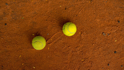 Top view of two tennis balls on the tennis court