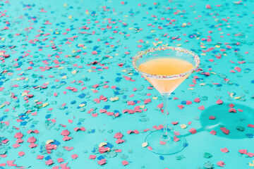 cocktail with a confetti background