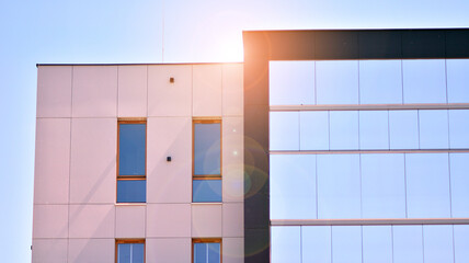 Apartment residential house and home facade architecture and outdoor facilities. Blue sky on the background. Sunlight in sunrise.