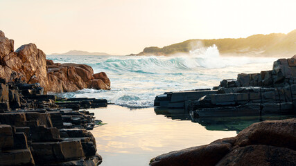 Wave breaking on sunset at Vale da Utopia, Santa Catarina, Brazil