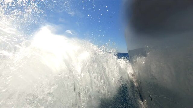 Bow wave of boat on sea in slow motion. Moving, travel, going, speed.