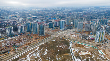 Aerial view of large construction site. Building new apartment blocks in residential area. Urban concept.