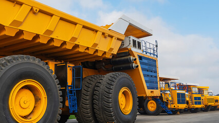 Big yellow mining truck. Details of the construction of a mining dump truck. Industry concept. © kalyanby