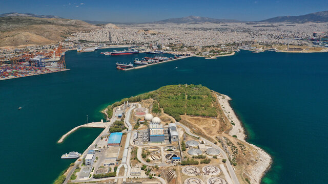 Aerial drone photo of latest technology sewage and sludge processing plant in small island of Psitalia or Psyttaleia, Piraeus, Attica, Greece