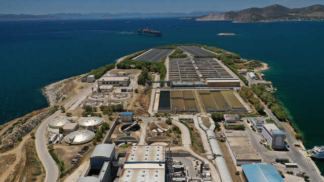 Aerial drone photo of latest technology sewage and sludge processing plant in small island of Psitalia or Psyttaleia, Piraeus, Attica, Greece
