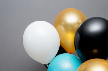 colorful helium balloons on a gray background. Banner with a place for the text