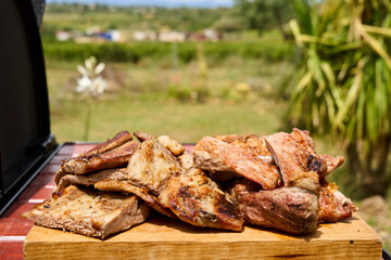 cooking on a charcoal and wood barbecue