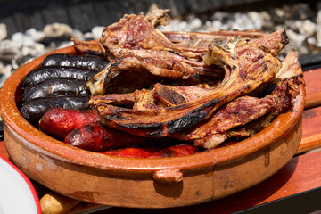 cooking on a charcoal and wood barbecue