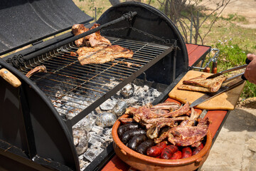cooking on a charcoal and wood barbecue