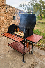 excellent portable barbecue made by hand in black.