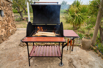 excellent portable barbecue made by hand in black.