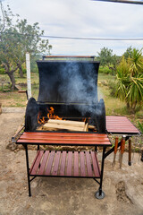 excellent portable barbecue made by hand in black.