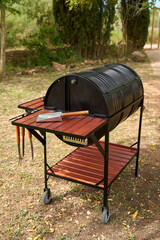 excellent portable barbecue made by hand in black.