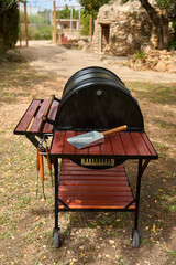 excellent portable barbecue made by hand in black.