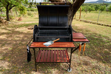 excellent portable barbecue made by hand in black.