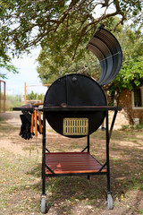 excellent portable barbecue made by hand in black.