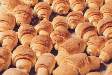 Homemade cakes with fresh oven-baked bagels on a baking sheet