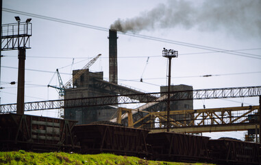 The factory emits dirty smoke from the pipes. Industry metallurgical plant. Environmental disaster and the smoke.