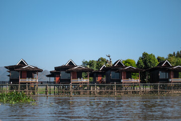 Fototapeta na wymiar Buildings by the riverside at Inle Lake, Myanmar