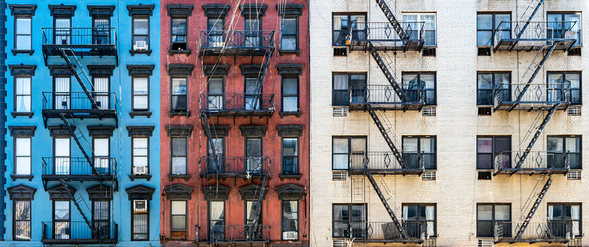 Red white and blue colored brick buildings on Second Avenue in the Upper East Side neighborhood of New York City NYC