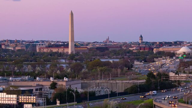 Washington DC city skyline with highway bridge and traffic timelapse from sunset to evening