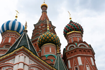 Fototapeta na wymiar Bottom view of famous Saint Basil cathedral in Moscow on Red Square. Bright domes, symbols of russian red square, recognizable landmark. Travel concept