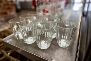 household items of daily use are placed on shelves and hang on holders in a large store 
