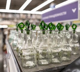 household items of daily use are placed on shelves and hang on holders in a large store 