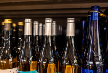 bottles of wine are on the shelves in a large store 