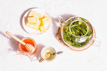 Teatime concept with aromatic mint tea, sweet honey