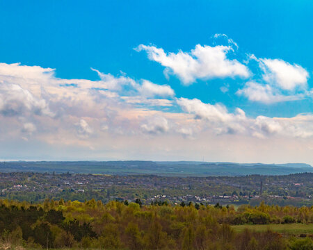 Looking down towards Leslie and Glenrothes from Formonthills on a  late spring day, in late afternoon.