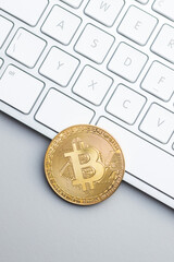 Golden bitcoin coin. Cryptocurrency and computer keyboard.