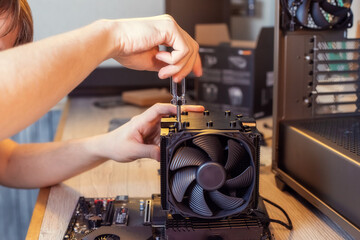 Installing a cooler on a personal computer processor.