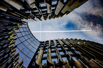 abstract business center with airplane crossing the sky