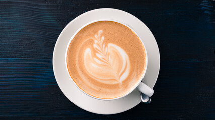 Cup of art latte or cappuccino coffee