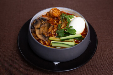 spicy ramen with mushrooms, eggs and seafood