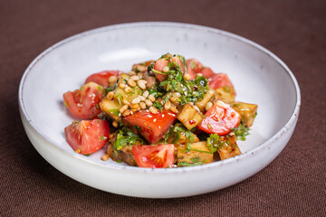 salad with tomatoes and walnuts in sauce