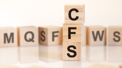 word cfs from wooden blocks with letters, concept