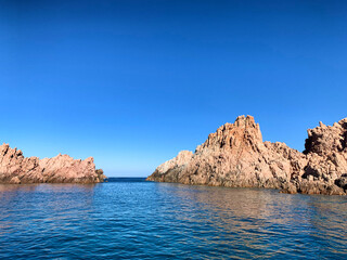 Fototapeta na wymiar Rocky coast and crystal clear sea, Sardinia, view from boat