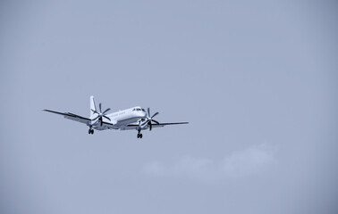 Fototapeta na wymiar Biplane plane with propellers landing
