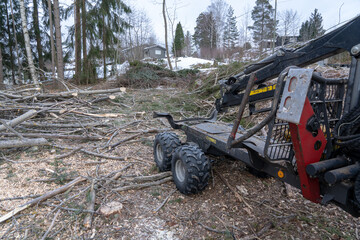 Wheeled forest crane standing on working area.