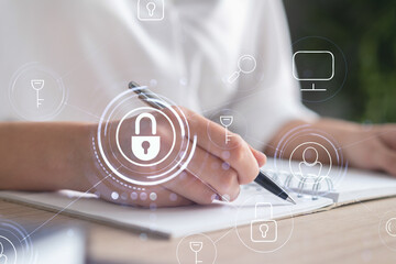 Businesswoman is taking notes of clients needs to protect cyber security from hacker attacks and...