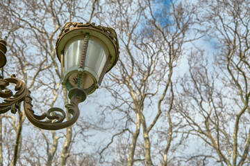 Fototapeta na wymiar turkey. vintage and retro style street lamp and painted with golden yellow in gulhane park istanbul.